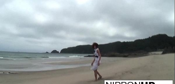  Asian hottie blows her man at the beach